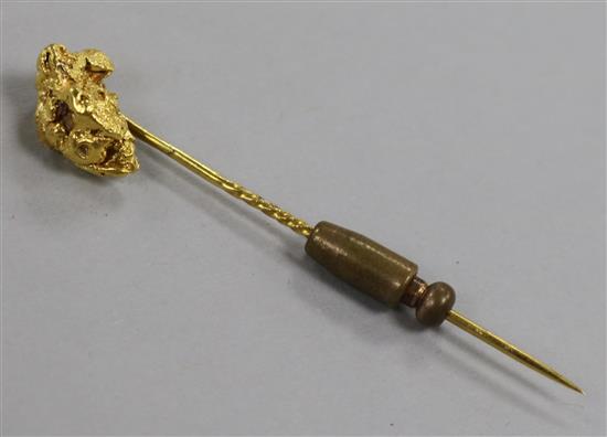 A Victorian yellow metal nugget stick pin, 64mm.